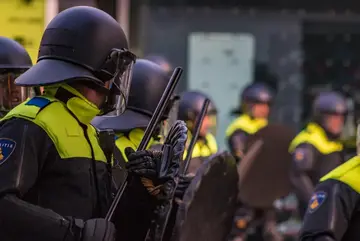 Police officers handling a riot